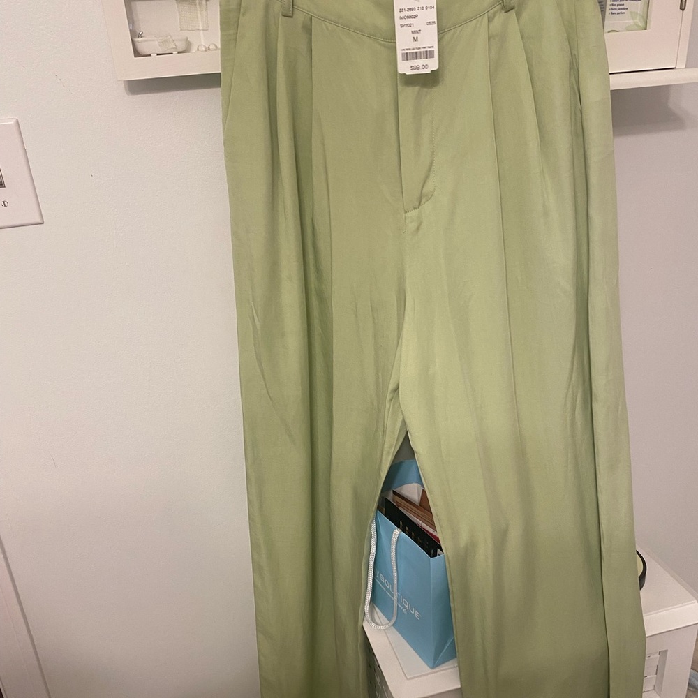 Wide leg green dress pants with pleats